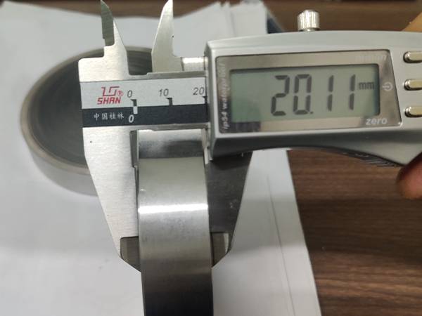 A caliper is used to check the thickness of flame arrestor element.