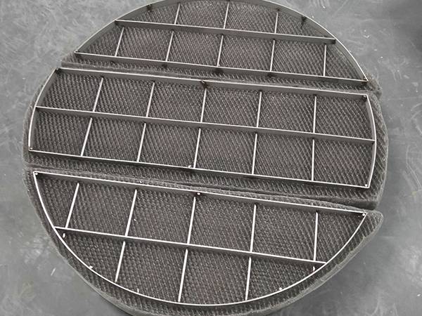 A mist eliminator with stainless steel grids placed on the floor