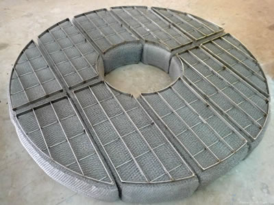 A round mist eliminator with 5 sections and grids.
