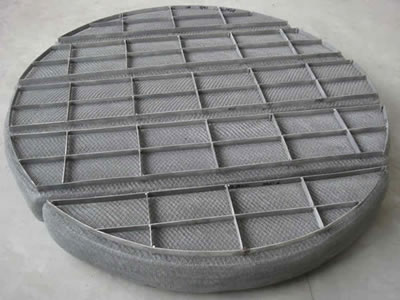 A round mist eliminator with 4 sections and grids.